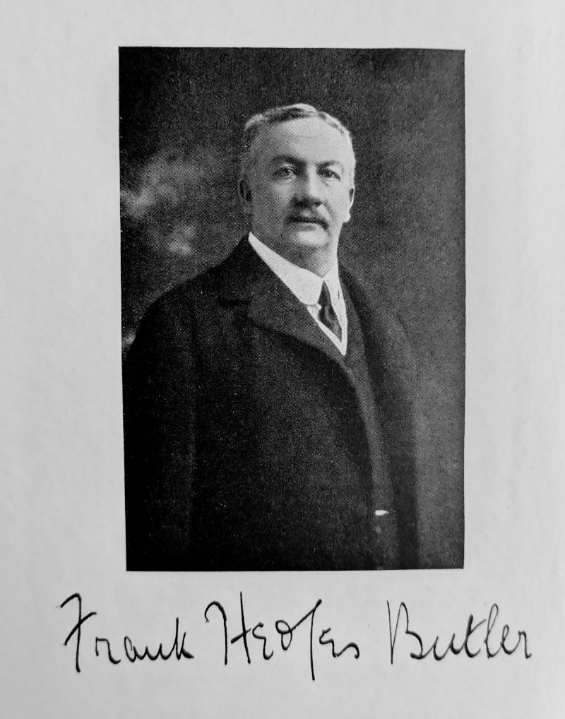 Black and white plate frontispiece showing author with printed signature beneath.